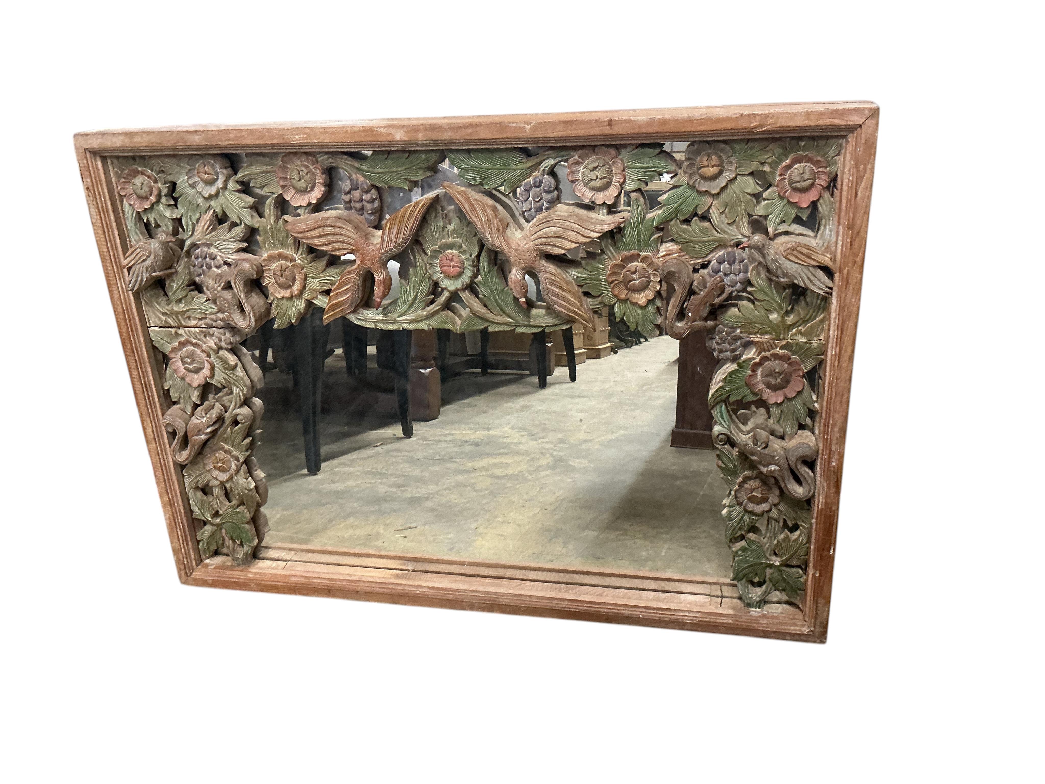 A Chinese rectangular painted carved hardwood wall mirror, width 86cm, height 61cm